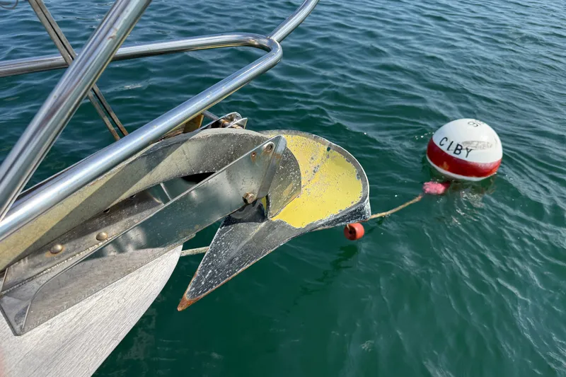 Slide: The Image of Bow of 1994 Pacific Seacraft Crealock 37 with anchor and buoy in water. - 57