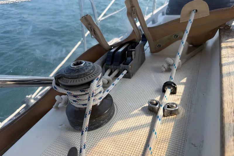 Slide: The Image of Deck of 1994 Pacific Seacraft Crealock 37 sailboat with winch and ropes. - 70