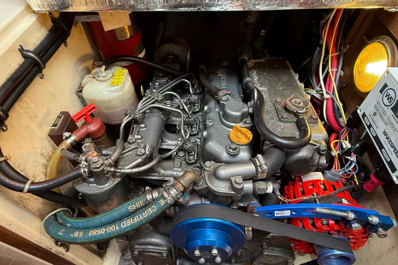 Slide: The Image of Engine compartment of a 1994 Pacific Seacraft Crealock 37 sailboat, showcasing detailed components. - 79