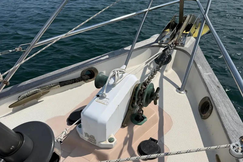 Slide: The Image of Bow of 1994 Pacific Seacraft Crealock 37 sailboat with anchor chain and windlass. - 53