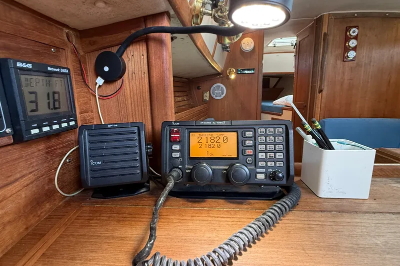Slide: The Image of Navigation equipment inside a 1994 Pacific Seacraft Crealock 37 sailboat cabin. - 25