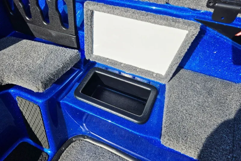 Slide: The Image of Interior of 2026 Phoenix 818 Pro boat with storage compartment and carpeted surfaces. - 37
