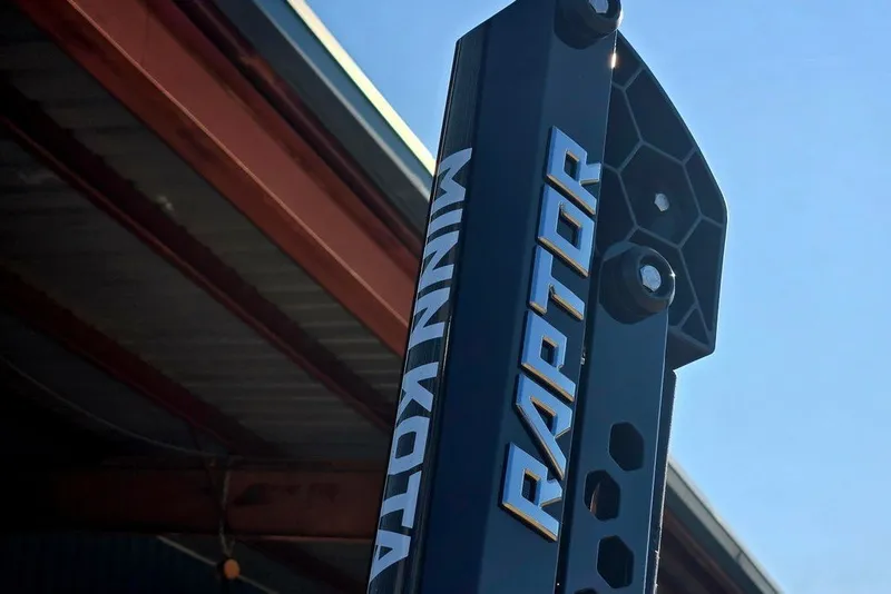 Slide: The Image of Phoenix 818 Pro 2026 model with Minn Kota Raptor mount under clear blue sky. - 10