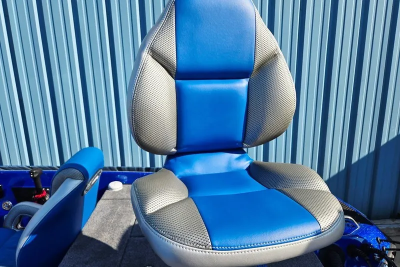 Slide: The Image of Blue and gray seat of 2026 Phoenix 818 Pro boat against corrugated metal background. - 62