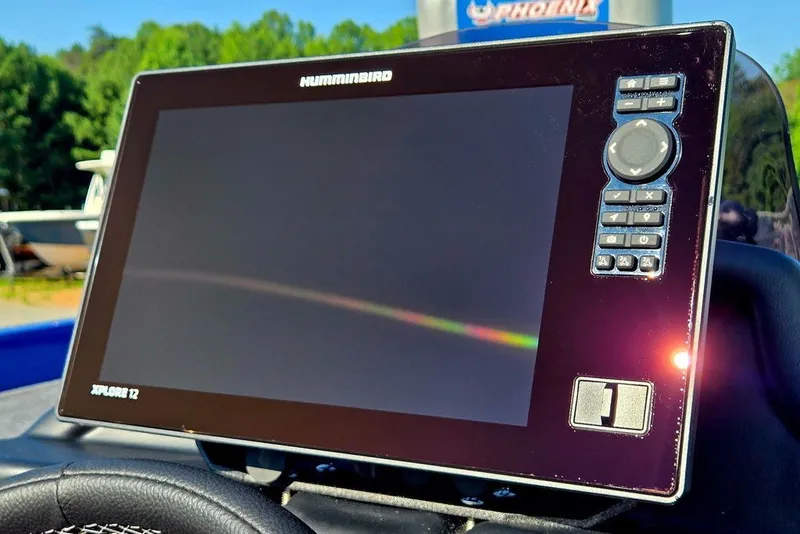 Slide: The Image of Humminbird Xplore 12 fishfinder on Phoenix 818 Pro, 2026 model, in a sunny outdoor setting. - 43