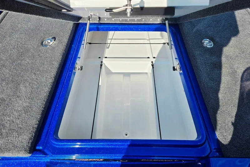 Slide: The Image of Open storage compartment in 2026 Phoenix 818 Pro boat, featuring blue and gray interior. - 28