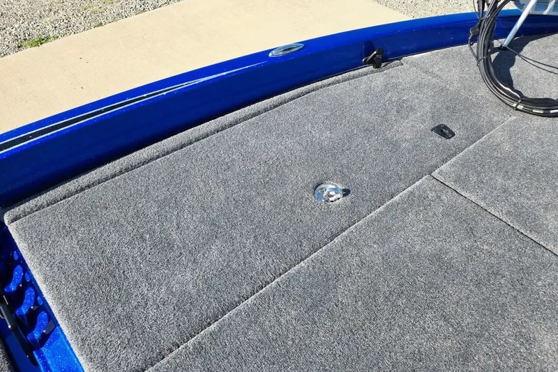 Slide: The Image of 2026 Phoenix 818 Pro boat deck with gray carpet and blue trim. - 26