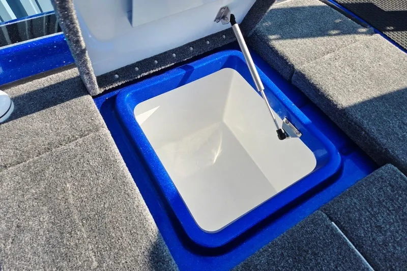 Slide: The Image of Open storage compartment in 2026 Phoenix 818 Pro boat with carpeted interior. - 57