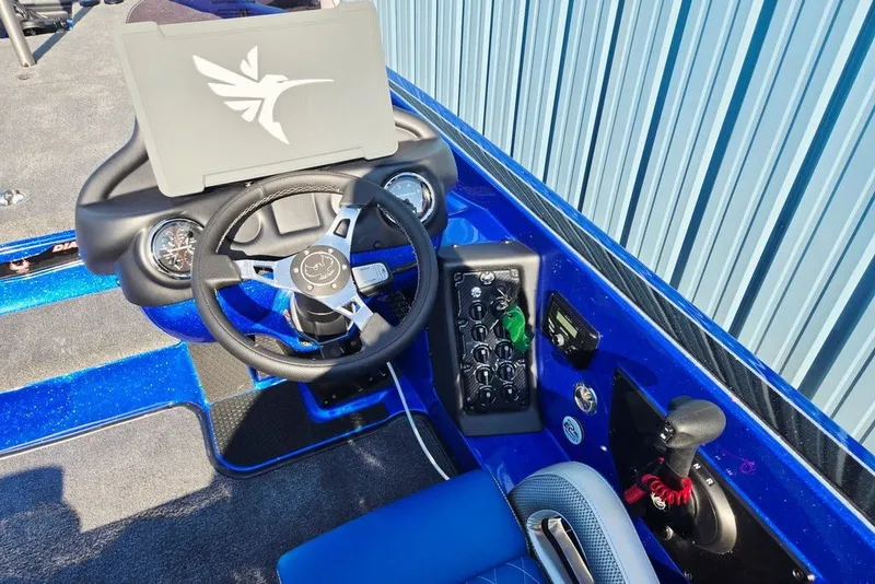 Slide: The Image of 2026 Phoenix 818 Pro boat cockpit with steering wheel and control panel. - 47
