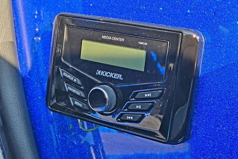 Slide: The Image of Kicker media center KMC45 in 2026 Phoenix 818 Pro, mounted on blue dashboard. - 48