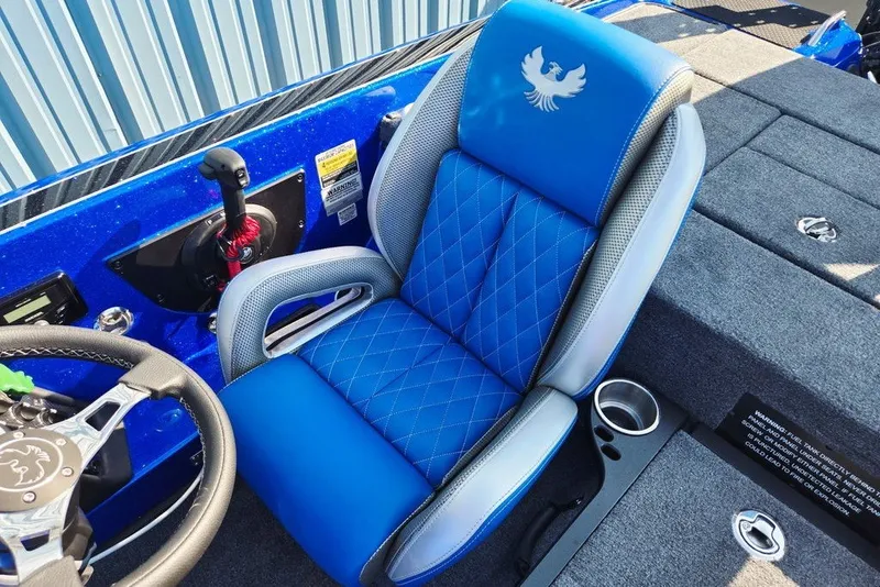 Slide: The Image of Blue and gray interior of 2026 Phoenix 818 Pro boat with steering wheel and seat. - 42