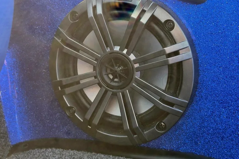 Slide: The Image of Close-up of a Phoenix 818 Pro 2026 speaker with a blue textured background. - 36
