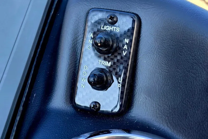 Slide: The Image of Control panel with switches for lights and trim on a 2026 Phoenix 818 Pro. - 13