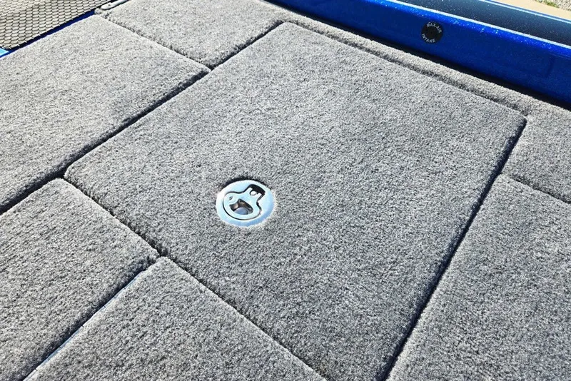 Slide: The Image of Carpeted deck of 2026 Phoenix 818 Pro boat with storage hatch. - 63