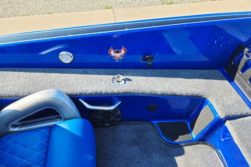Slide: The Image of Interior of 2026 Phoenix 818 Pro boat with blue seating and carpeted flooring. - 35