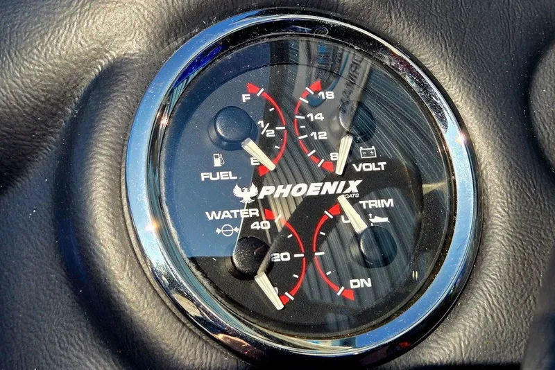 Slide: The Image of Dashboard gauges of 2026 Phoenix 818 Pro boat, displaying fuel, voltage, water, and trim levels. - 44
