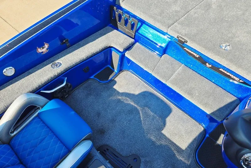 Slide: The Image of Interior of 2026 Phoenix 818 Pro boat with blue seating and carpeted flooring. - 29