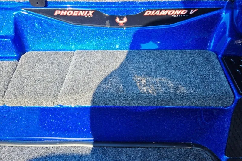 Slide: The Image of Blue Phoenix 818 Pro boat with Diamond V hull design, featuring carpeted steps, 2026 model. - 30