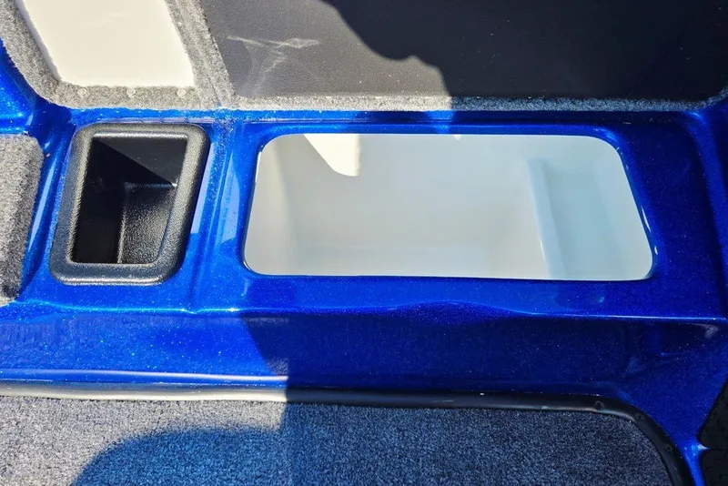 Slide: The Image of Blue interior compartment of 2026 Phoenix 818 Pro boat, featuring storage space. - 31