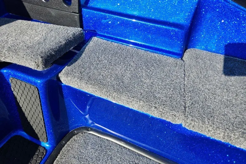 Slide: The Image of Blue Phoenix 818 Pro 2026 boat interior with gray carpeted seating. - 41