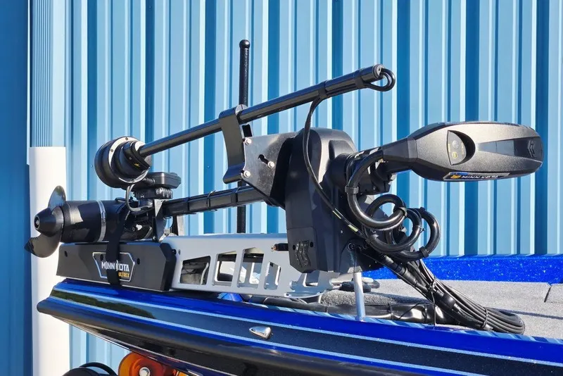 Slide: The Image of 2026 Phoenix 818 Pro boat with Minn Kota Ultrex trolling motor, blue background. - 27