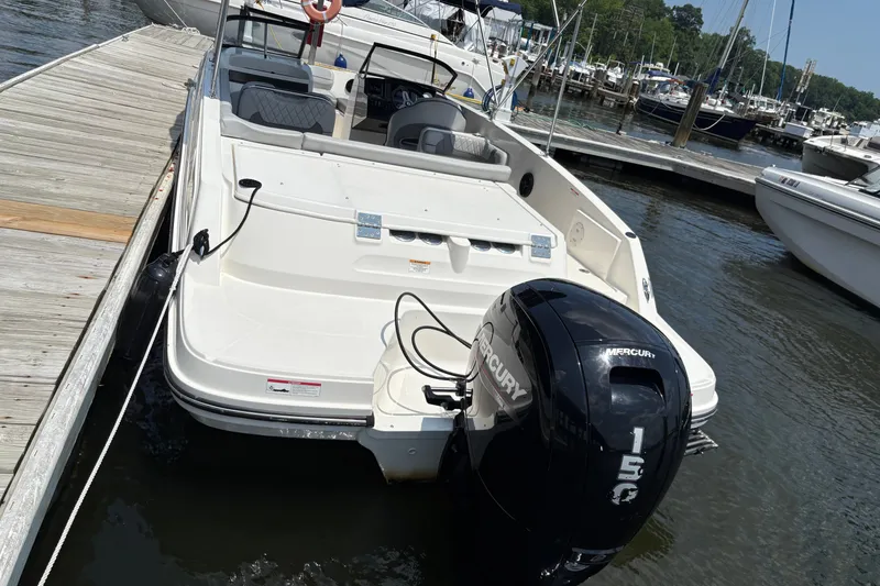 Slide: The Image of 2023 Bayliner VR6 Bowrider OB docked with Mercury 150 outboard engine. - 8