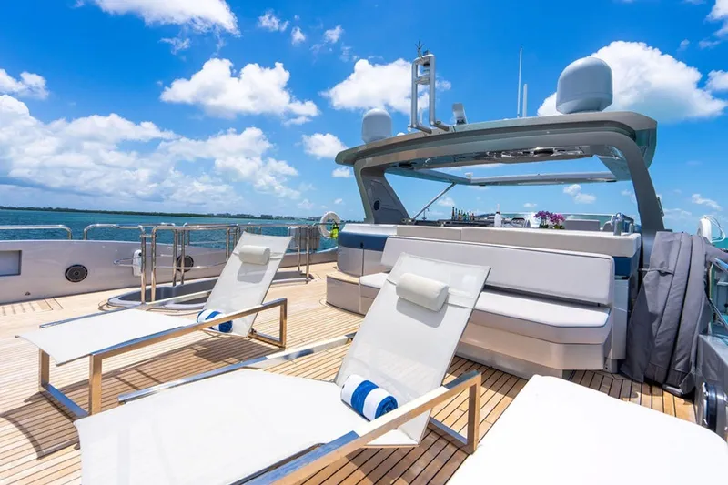 Slide: The Image of Luxurious 2008 Azimut 95 yacht deck with sun loungers and ocean view. - 31