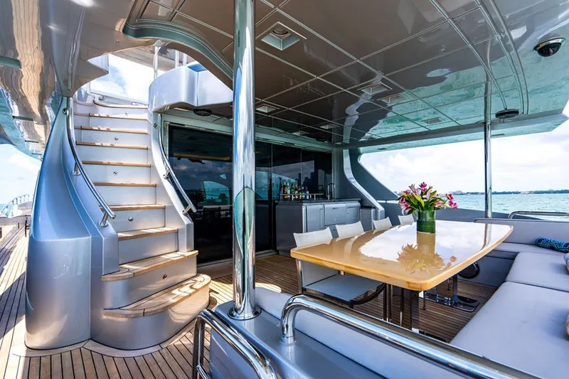 Slide: The Image of Luxurious 2008 Azimut 95 yacht deck with elegant dining area and ocean view. - 25
