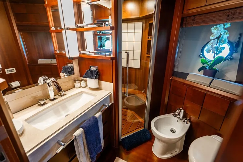 Slide: The Image of Luxurious bathroom on 2008 Azimut 95 yacht with elegant wood finishes and modern fixtures. - 16