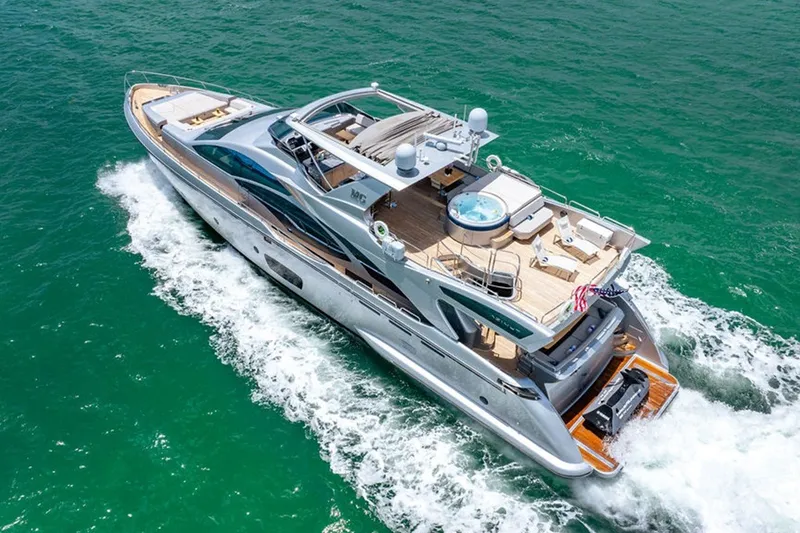Slide: The Image of Luxurious 2008 Azimut 95 yacht cruising on vibrant turquoise waters. - 36
