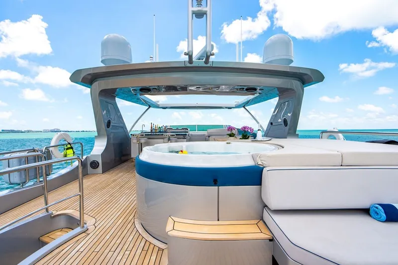 Slide: The Image of Luxurious 2008 Azimut 95 yacht deck with jacuzzi and ocean view. - 28