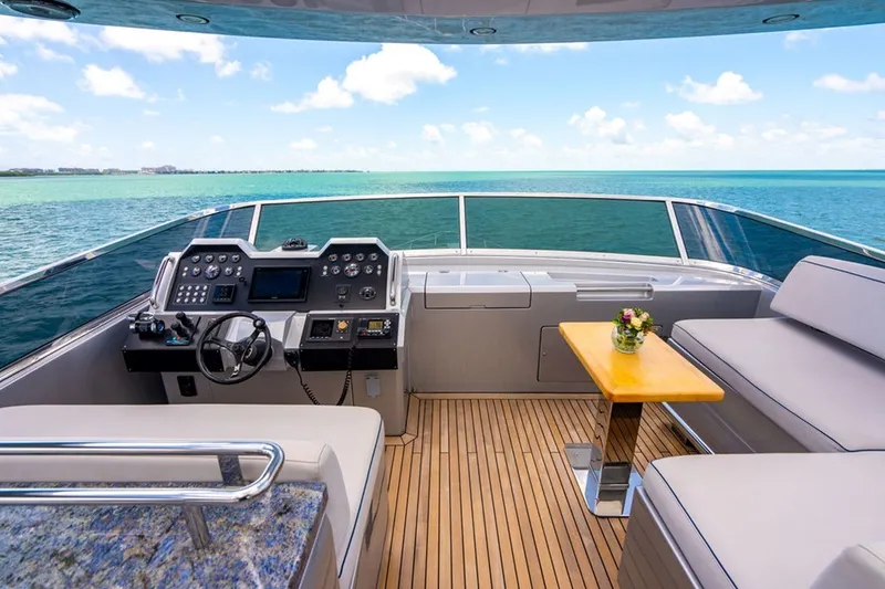 Slide: The Image of Luxurious 2008 Azimut 95 yacht helm with ocean view, featuring modern controls and seating. - 30