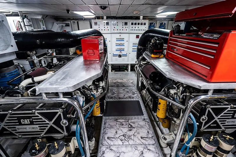 Slide: The Image of Engine room of a 2008 Azimut 95 yacht with CAT marine power engines and tool storage. - 35