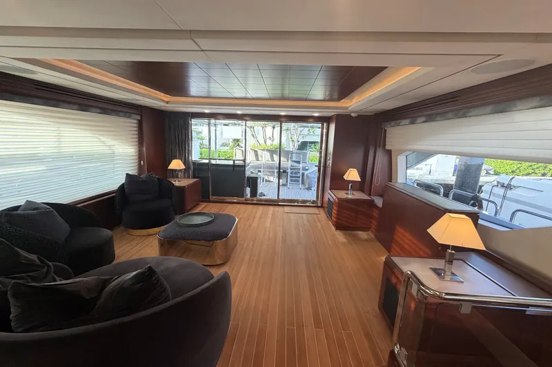 Slide: The Image of Luxurious interior of a 2008 Azimut 95 yacht with elegant seating and wooden flooring. - 39