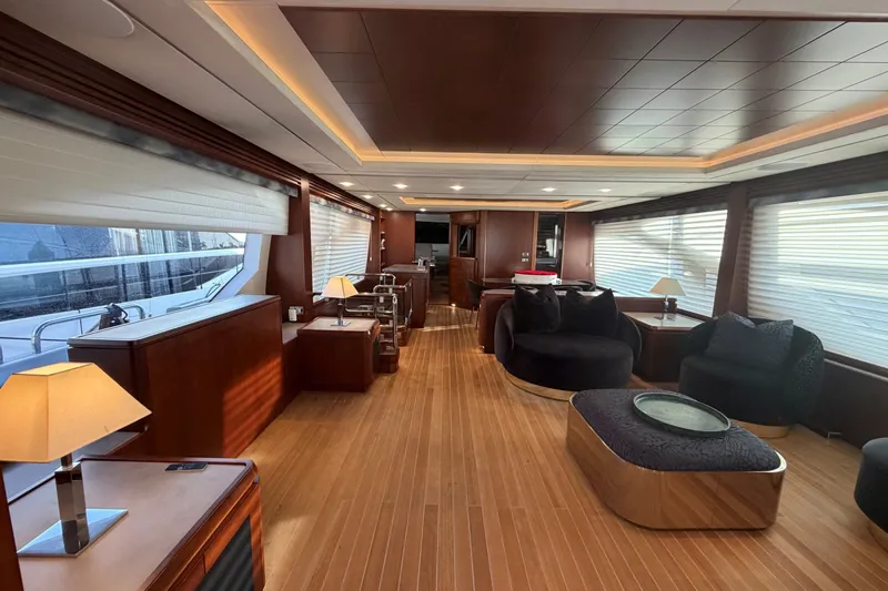 Slide: The Image of Luxurious interior of a 2008 Azimut 95 yacht with elegant wood finishes and modern furnishings. - 42