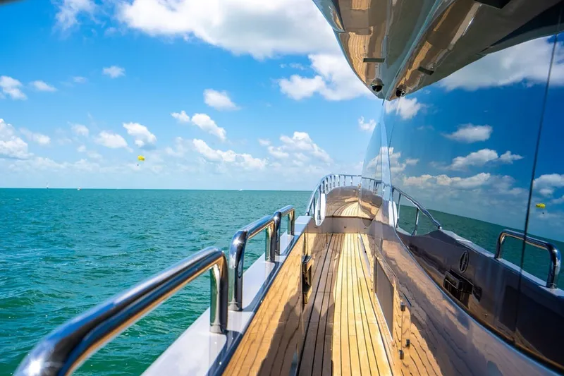 Slide: The Image of Luxurious 2008 Azimut 95 yacht cruising on a sunny day, reflecting blue skies and ocean. - 26