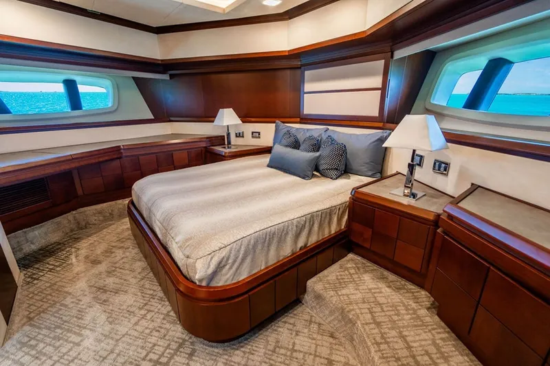 Slide: The Image of Luxurious bedroom interior of 2008 Azimut 95 yacht with elegant wood finishes and ocean view. - 15