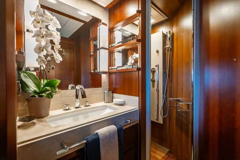 Slide: The Image of Luxurious bathroom on 2008 Azimut 95 yacht with elegant wood finishes and modern fixtures. - 18