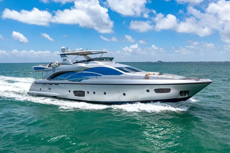 Slide: The Image of Luxury 2008 Azimut 95 yacht cruising on open sea under blue sky. - 38
