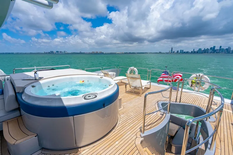 Slide: The Image of Luxurious Azimut 95 yacht deck with hot tub, ocean view, and city skyline, 2008 model. - 32