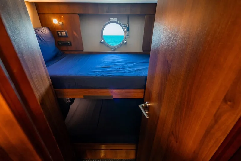 Slide: The Image of Cozy cabin with bunk beds and porthole on 2008 Azimut 95 yacht. - 22