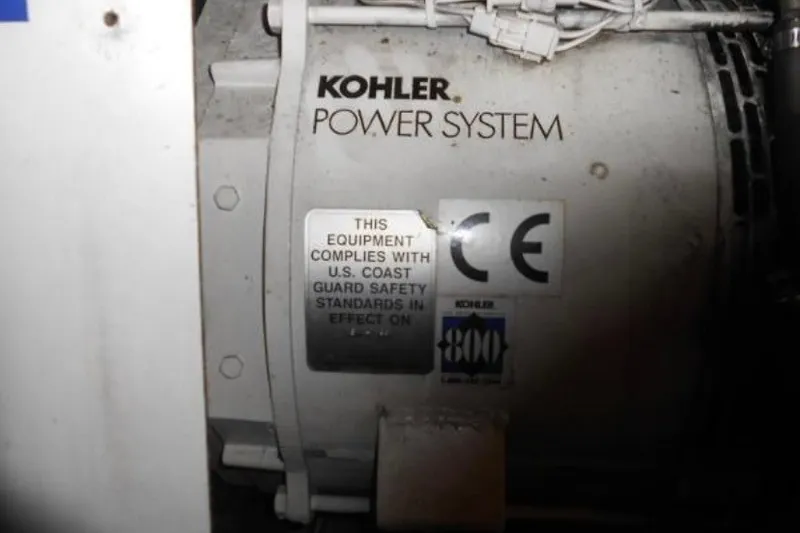 Slide: The Image of Kohler power system on 1997 Riviera 34 Convertible, compliant with U.S. Coast Guard safety standards. - 46