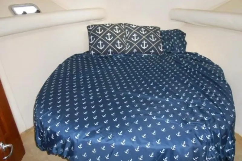 Slide: The Image of Nautical-themed bed in 1997 Riviera 34 Convertible yacht cabin. - 43