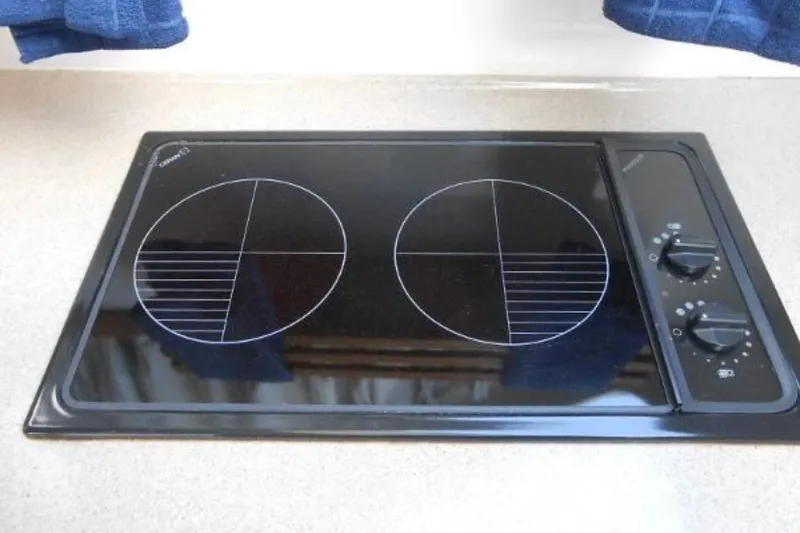 Slide: The Image of Electric stovetop with two burners on a 1997 Riviera 34 Convertible yacht. - 32