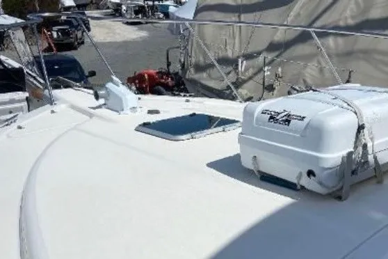 Slide: The Image of 1997 Riviera 34 Convertible yacht deck with equipment and hatch. - 19