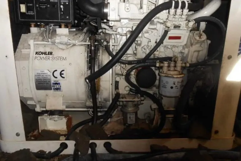 Slide: The Image of Kohler power system engine in a 1997 Riviera 34 Convertible boat. - 45