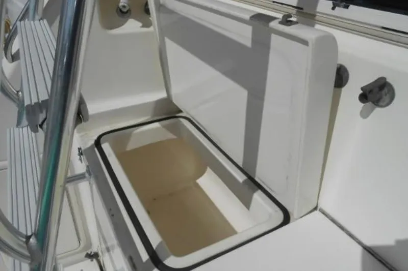 Slide: The Image of Open storage compartment on a 1997 Riviera 34 Convertible boat deck. - 34