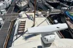 Slide: The Image of 1978 Hatteras 43 Double Cabin yacht docked at a marina. - 4