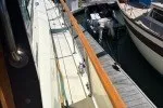 Slide: The Image of 1978 Hatteras 43 Double Cabin yacht docked at a marina, side view. - 28