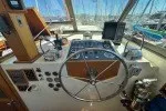 Slide: The Image of 1978 Hatteras 43 Double Cabin helm with steering wheel and navigation equipment. - 26